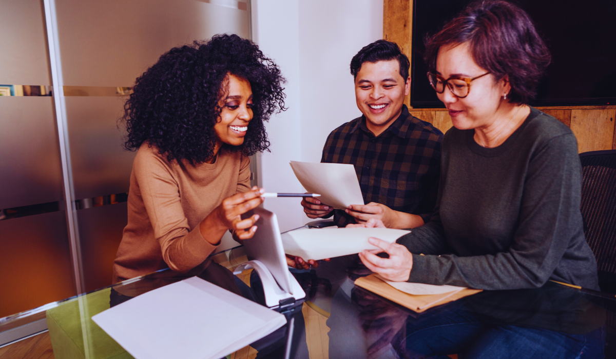 A woman teaching an expat couple in the Netherlands on how to get a sponsoirship visa