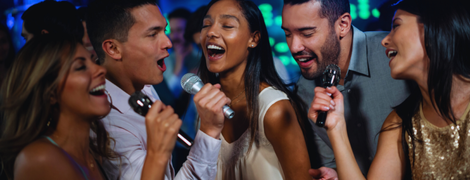 A group of friends singing at one of the best karaoke bars in the netherlands