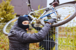 A bicycle thief stealing a bike