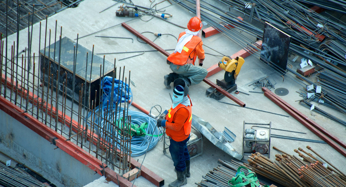two men working on a house foundation in the netherlands