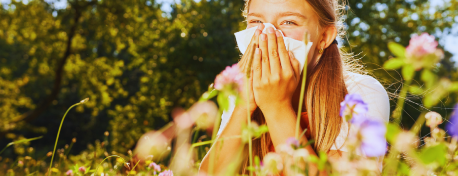 a young girl sneexing with hay fever in the netherlands