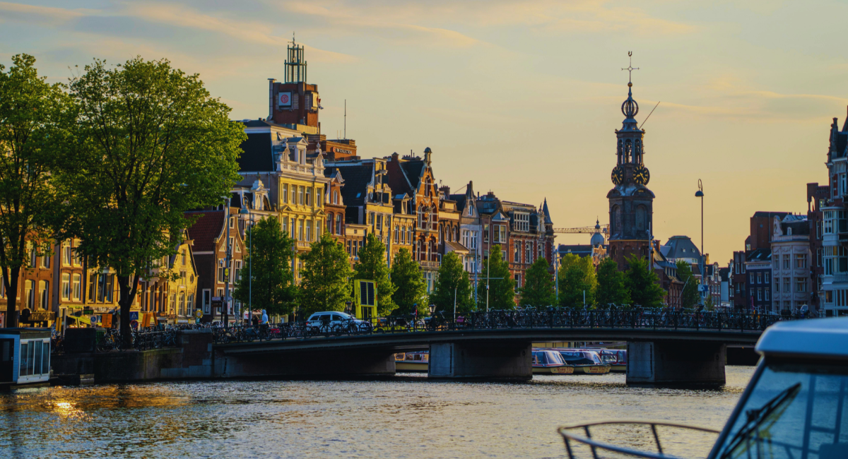 A scenic view of Amsterdam canals at sunset
