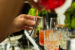 closeup of a bartender mixing an alcoholic cocktail at a fancy bar