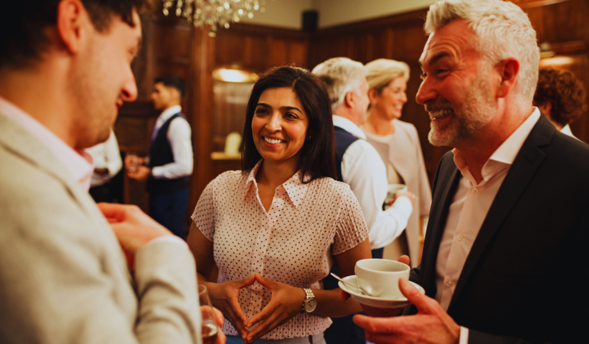 Midlife professionals networking at a conference