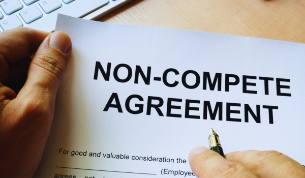 Man signing a non-compete clause