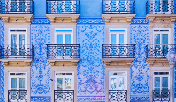Traditional historic facade in Porto decorated with blue tiles
